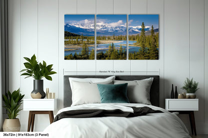 a bedroom scene with a bed and two paintings on the wall