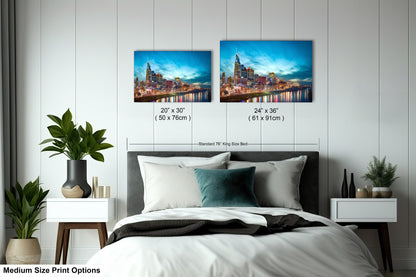 a bedroom with a bed and two pictures on the wall