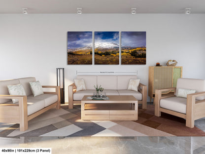 a living room filled with furniture and a painting on the wall