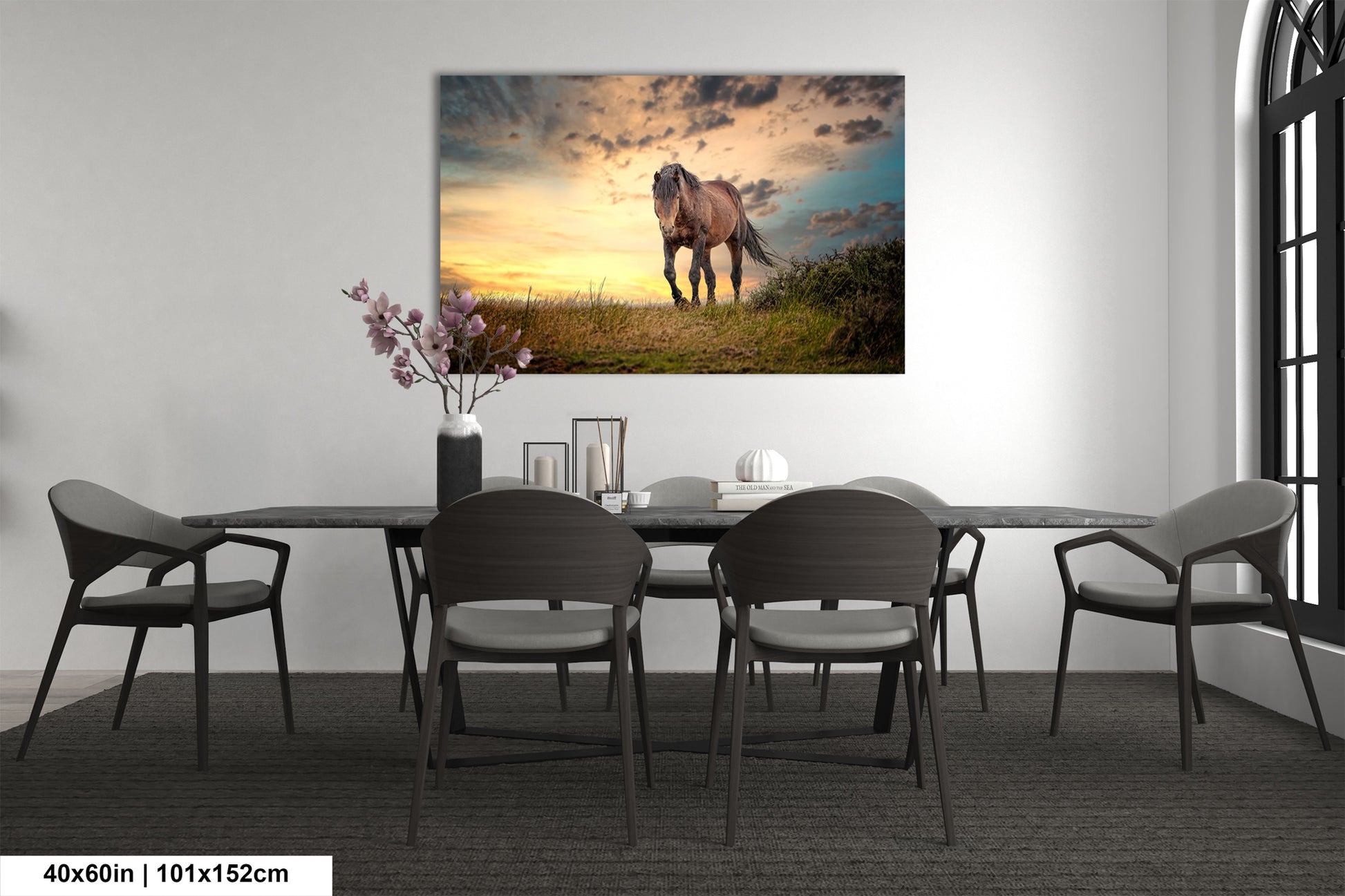 a dining room table with chairs and a painting on the wall