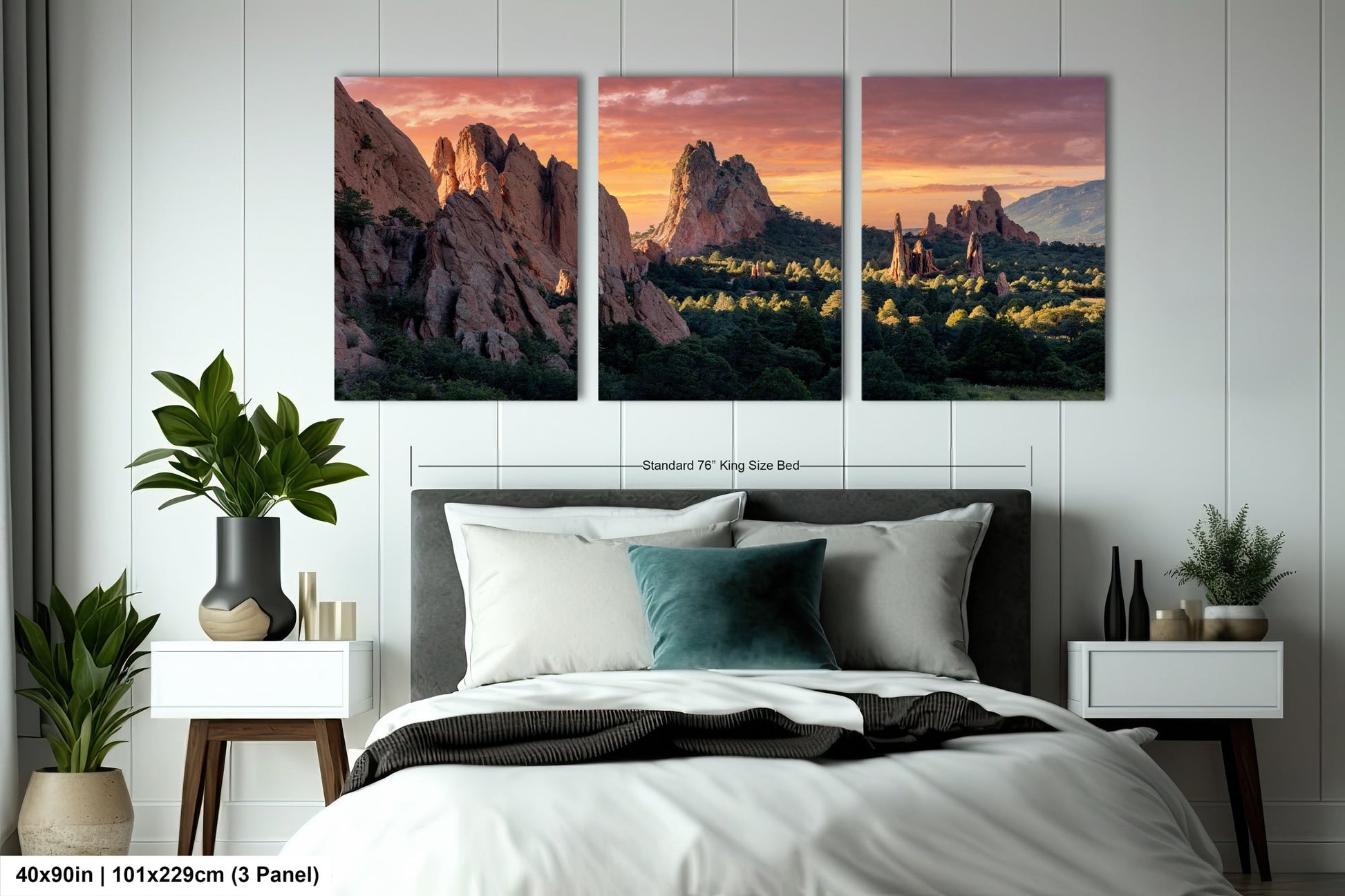 a bedroom with a bed and two paintings on the wall