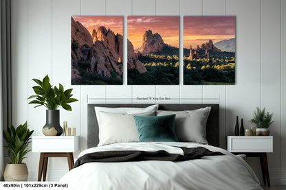 a bedroom with a bed and two paintings on the wall