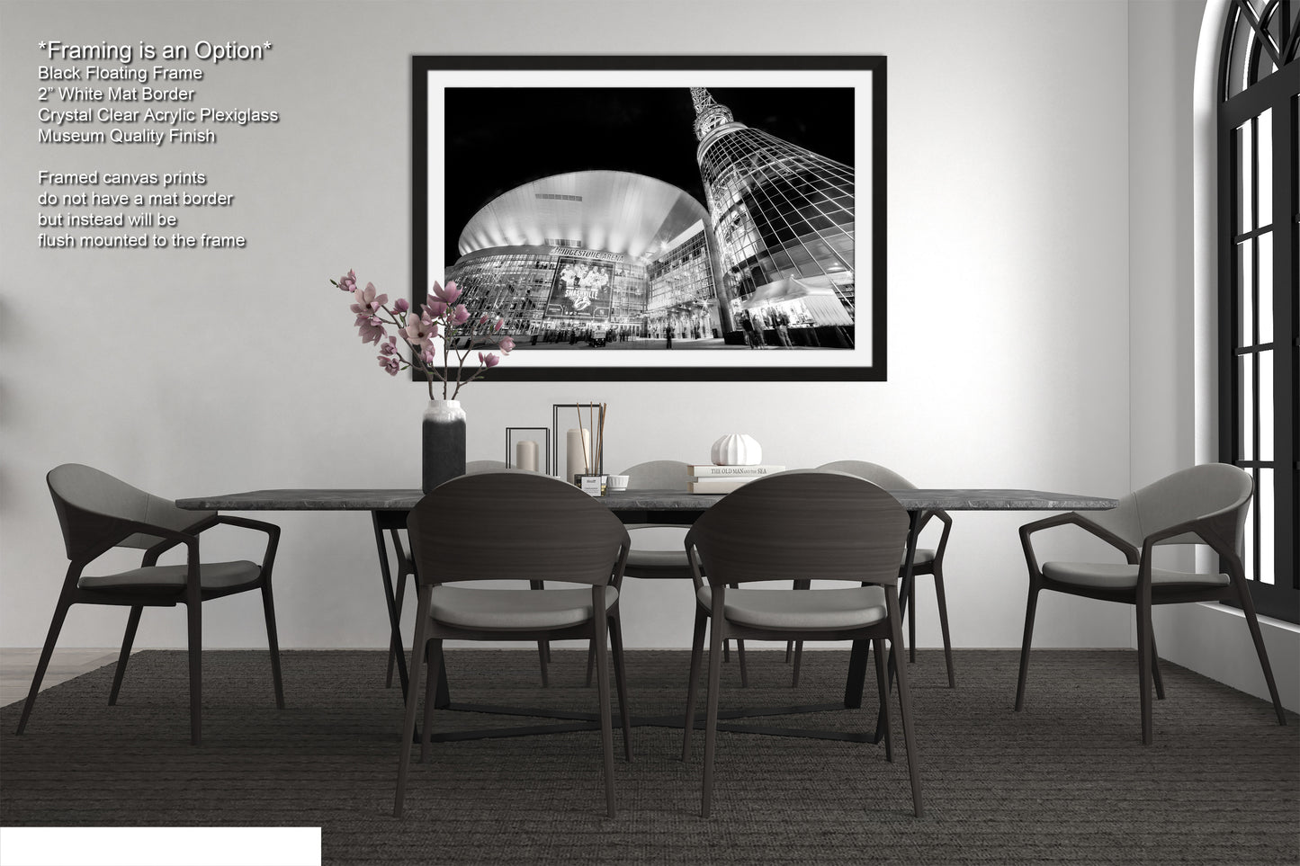 a black and white photo of a dining room