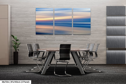 a dining room table with chairs and a painting on the wall