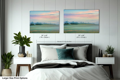 a bedroom with a bed and two paintings on the wall