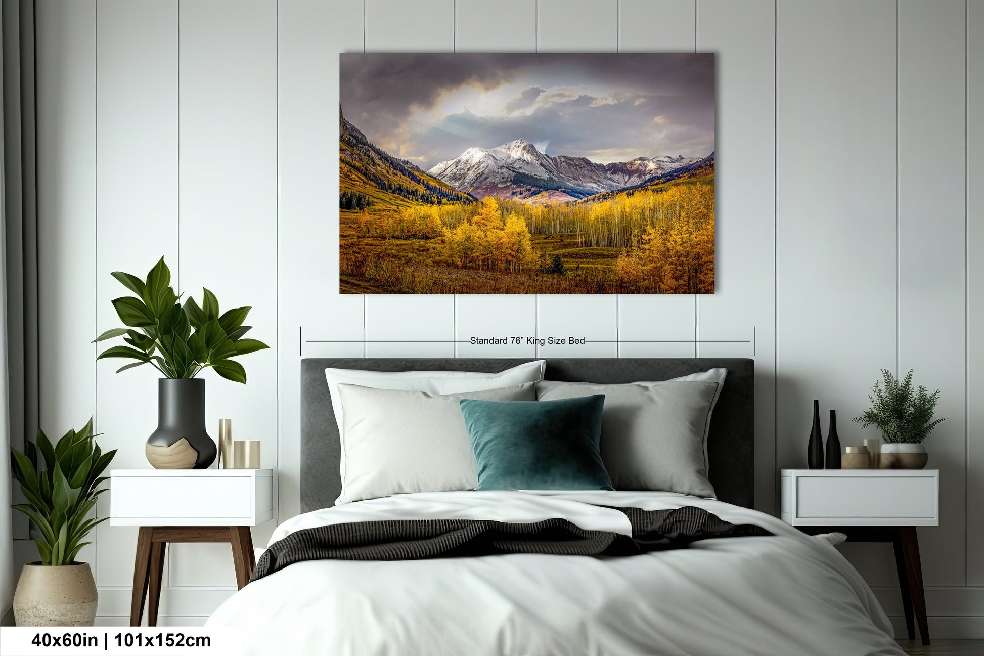 a bed in a room with a painting on the wall