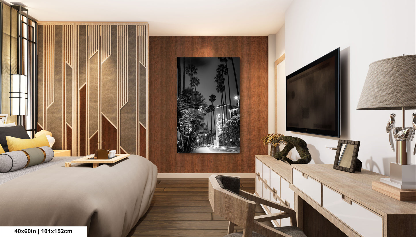 a bed room with a neatly made bed and a flat screen tv
