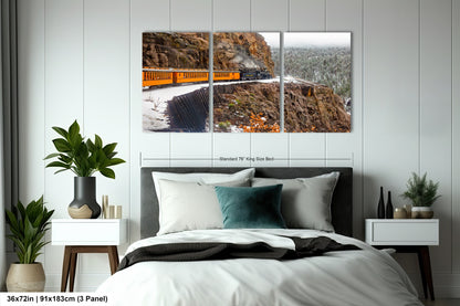 a bed room with a neatly made bed and two pictures on the wall