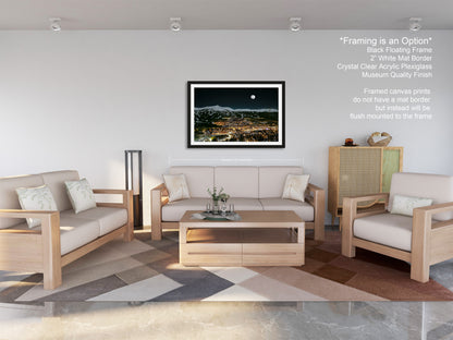 a living room filled with furniture and a painting on the wall