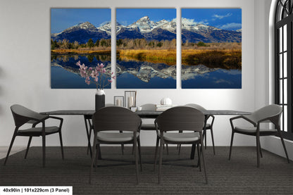 a dining room table with four chairs and a table with four chairs in front of