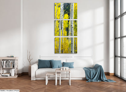 a living room with a couch and a painting on the wall