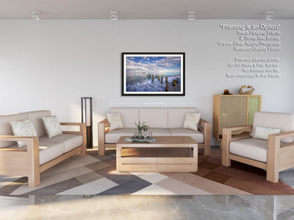 a living room filled with furniture and a painting on the wall