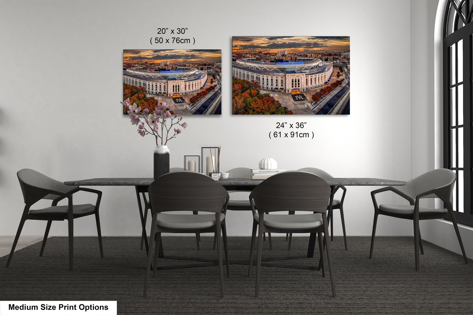 a dining room table with four chairs and a vase of flowers