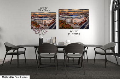 a dining room table with four chairs and a vase of flowers