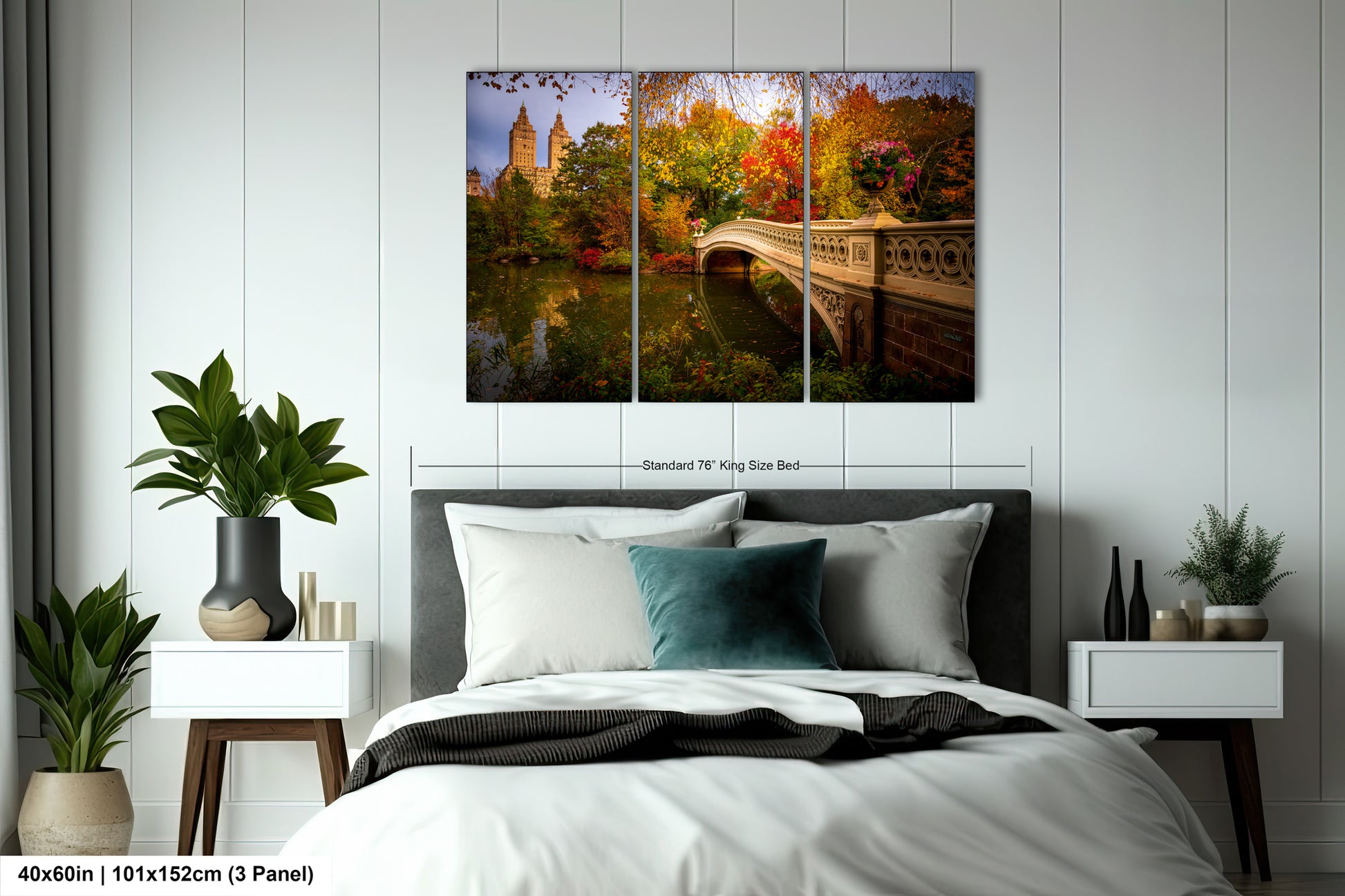 The image is a bedroom with a large bed, nightstands, and a painting of a bridge and trees hanging on the wall.