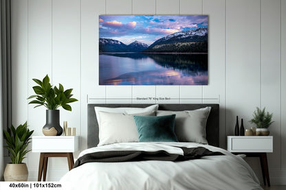 a bedroom with a bed and a painting on the wall