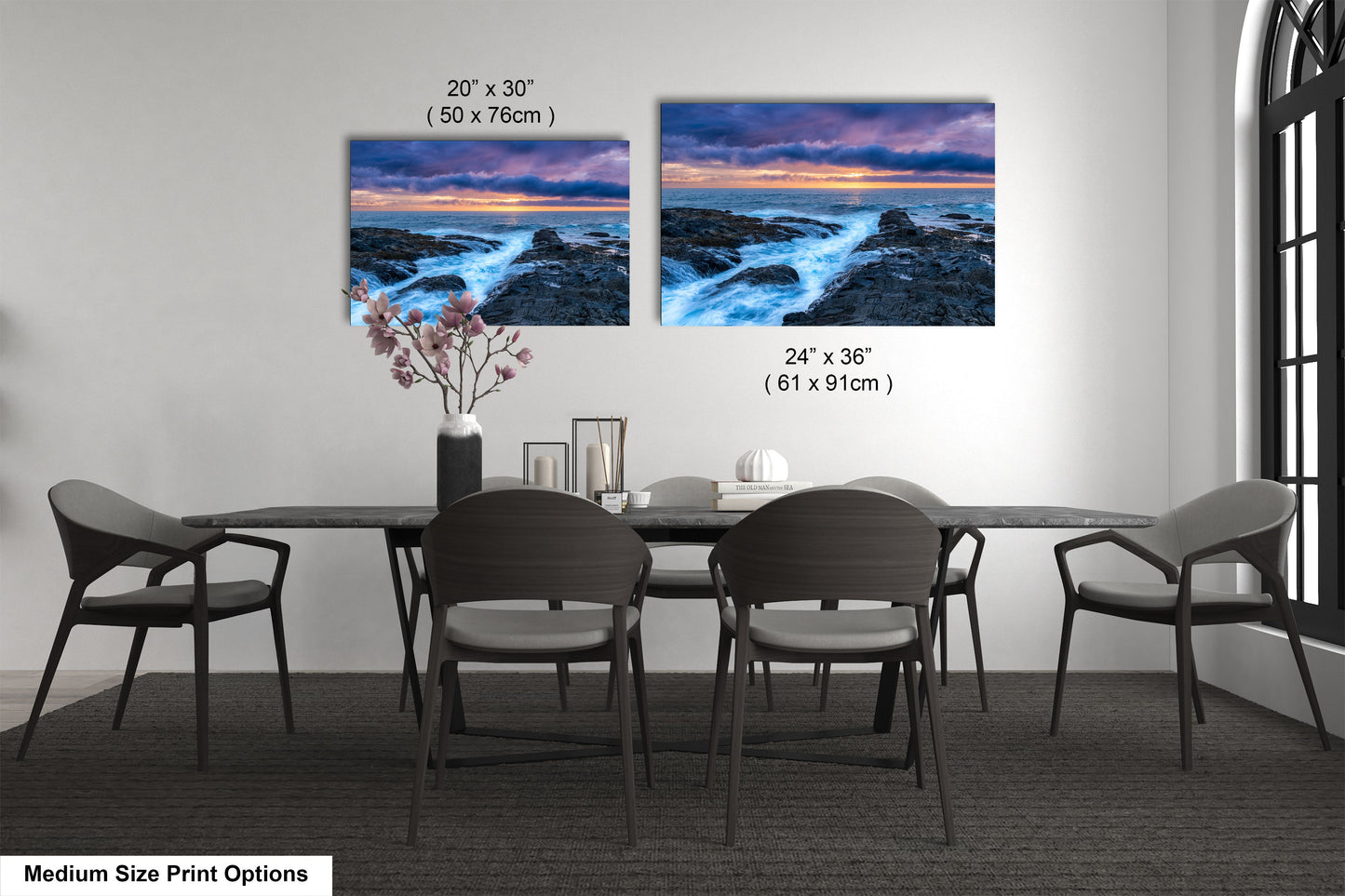 a dining room table with four chairs and a vase of flowers
