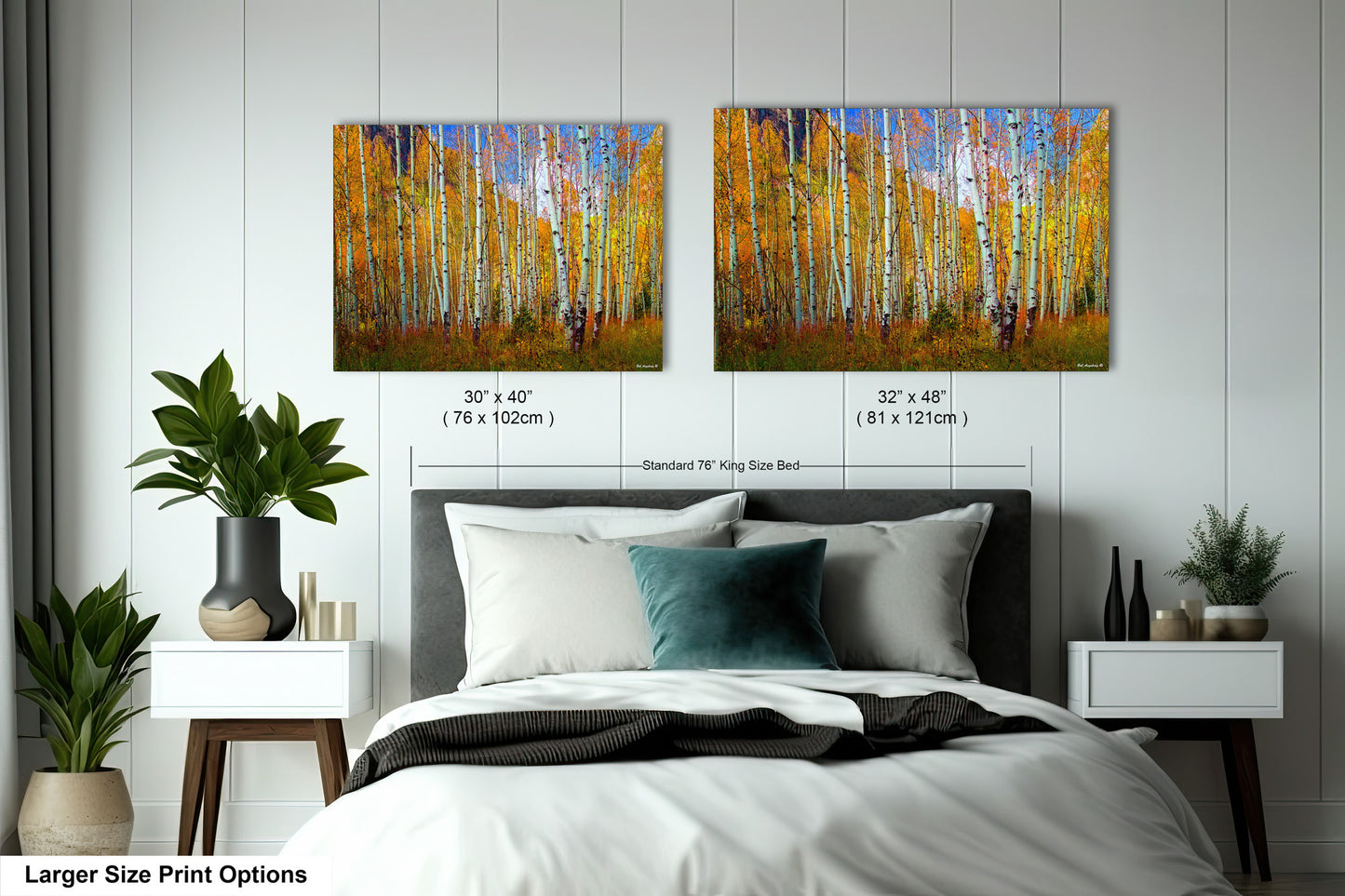 a bedroom with a bed and two paintings on the wall