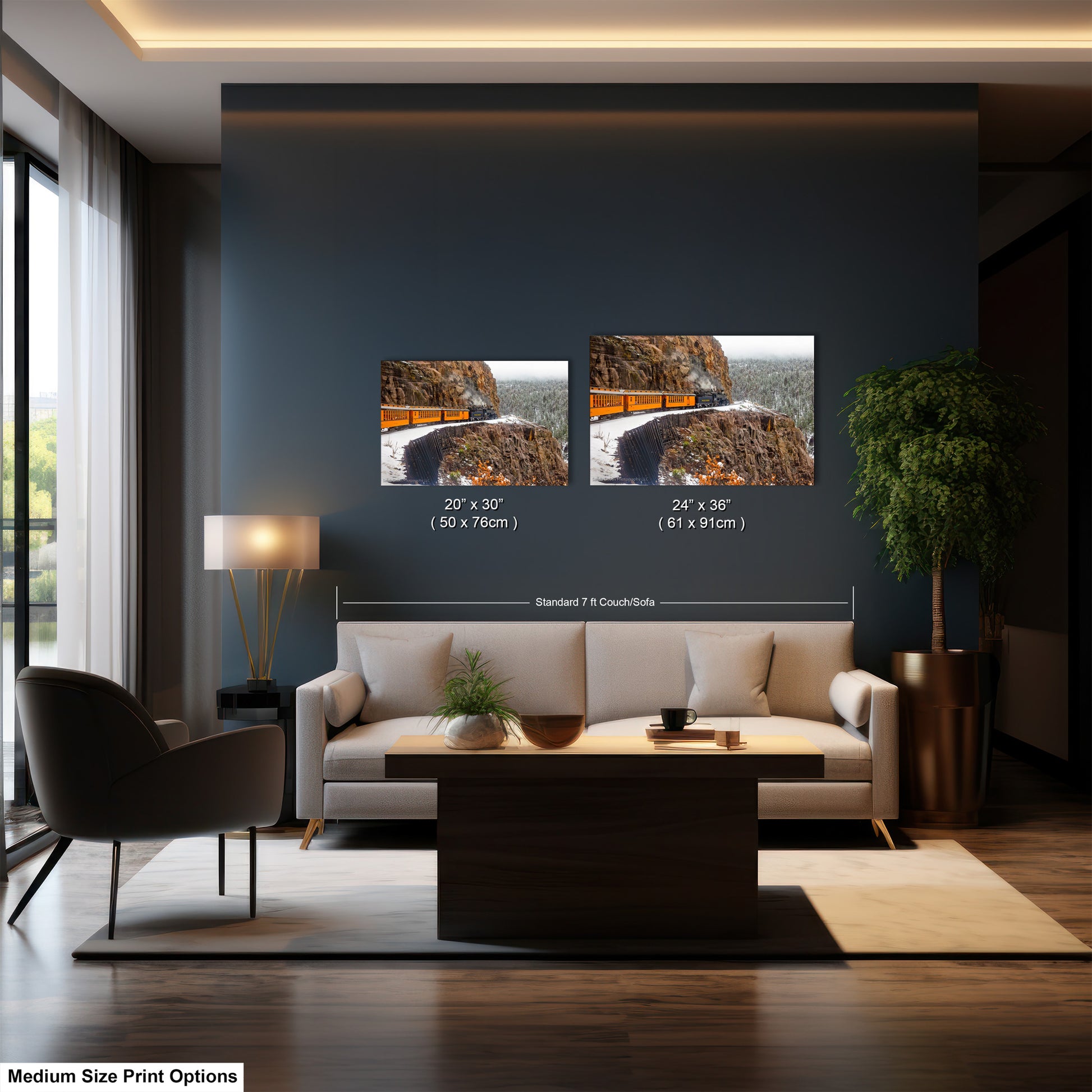 a living room with a couch and two pictures on the wall