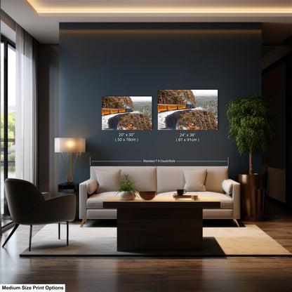 a living room with a couch and two pictures on the wall