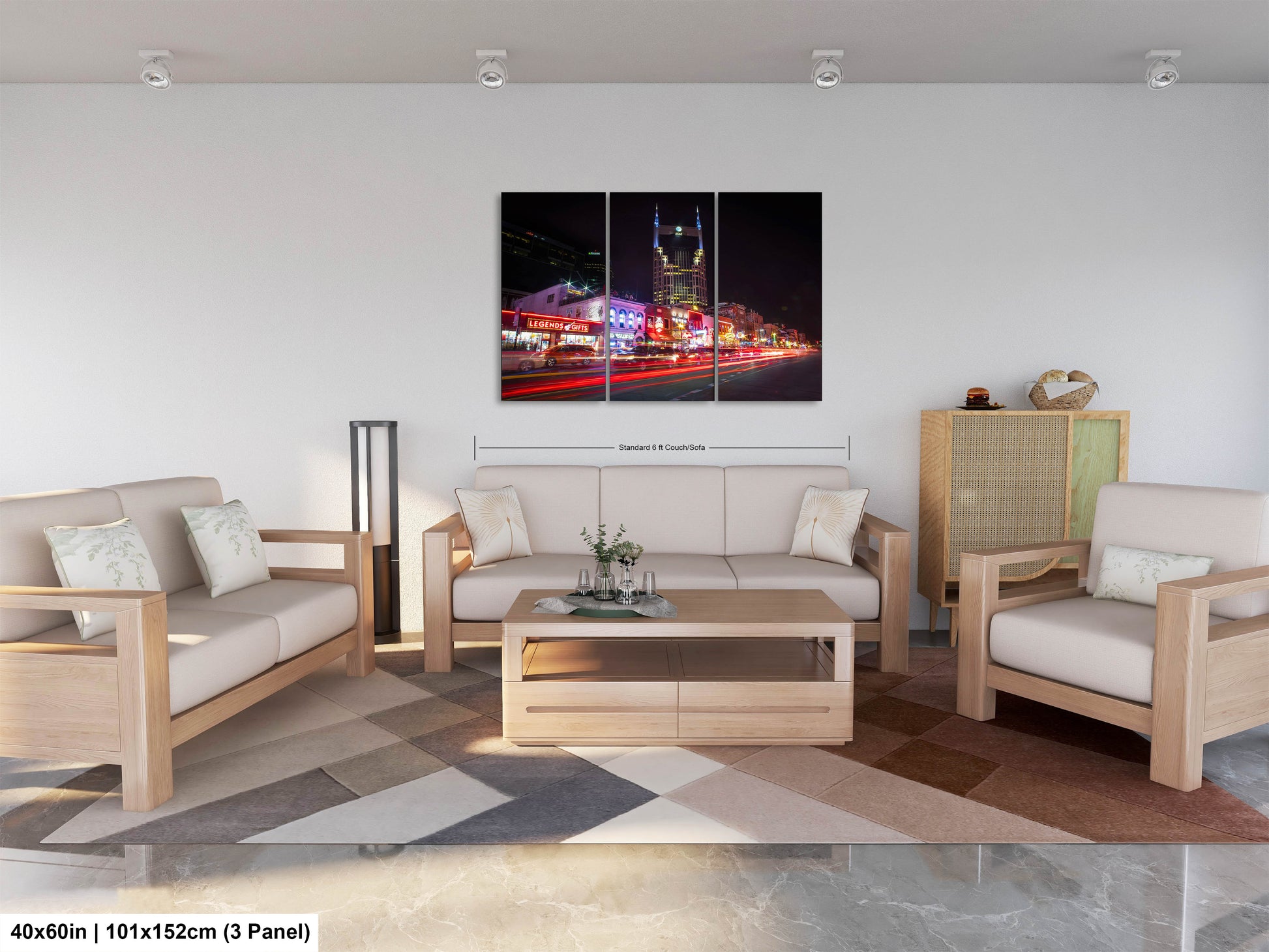 a living room filled with furniture and a painting on the wall