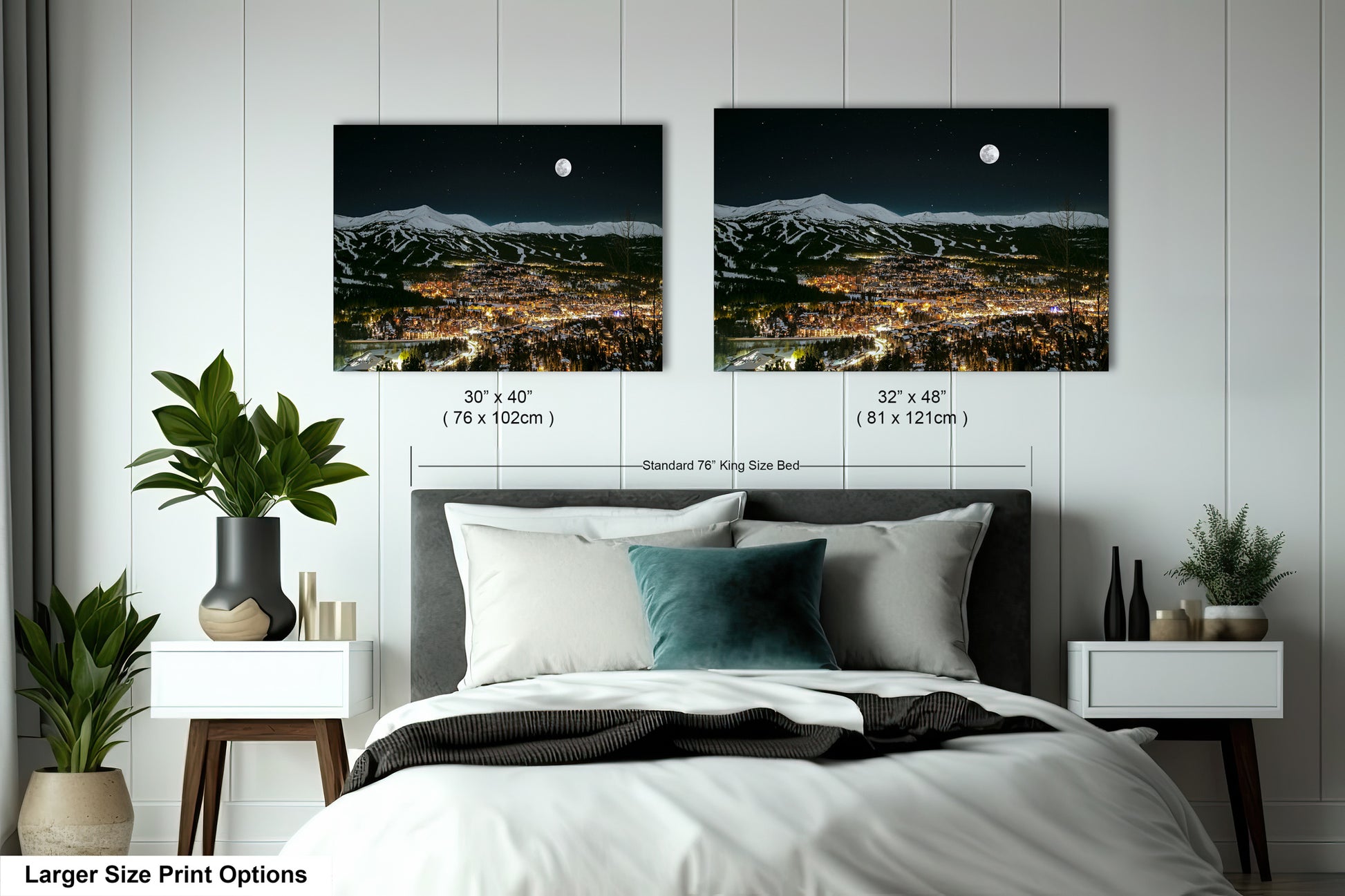 a bedroom with a bed and two pictures on the wall
