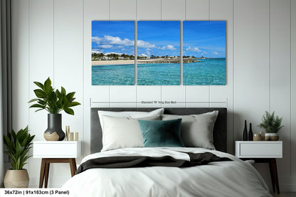 a bedroom scene with a bed and a wall hanging