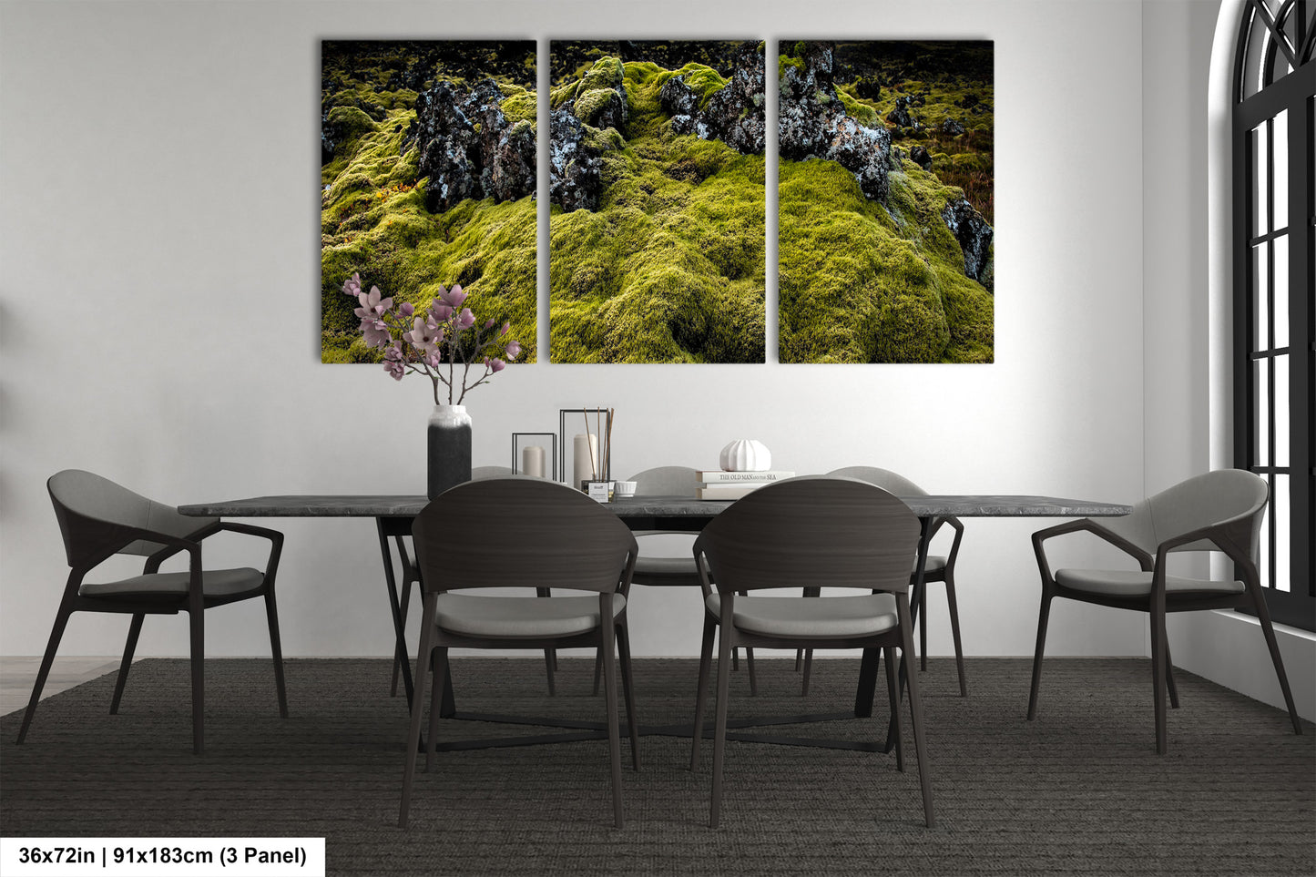 a dining room table with chairs and a painting on the wall