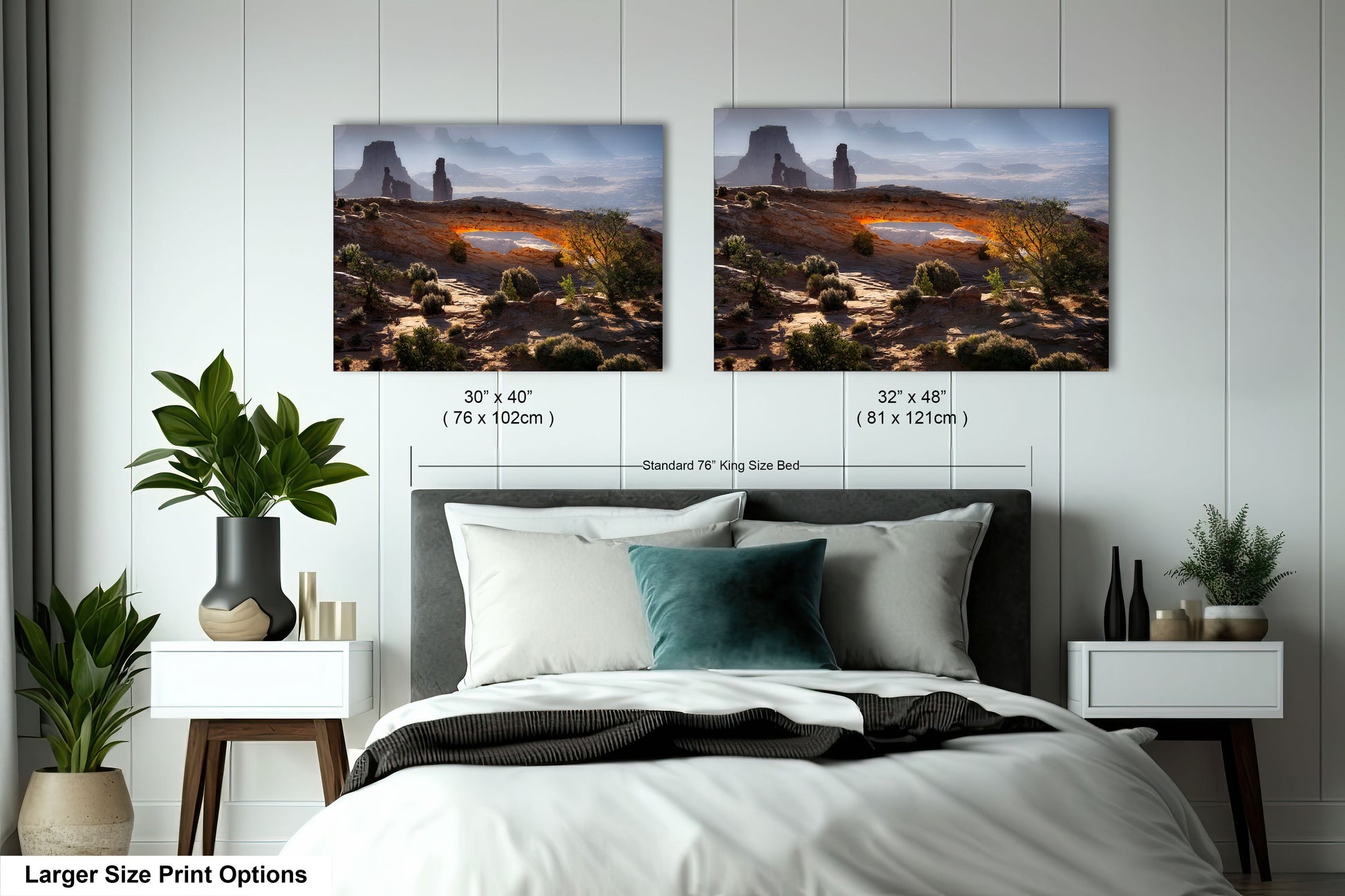 a bed with two pictures on the wall above it