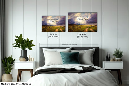 a bedroom with a bed and two pictures on the wall