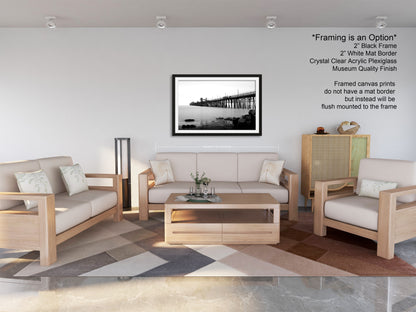 a living room filled with furniture and a picture on the wall