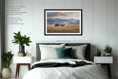 a bedroom with a bed and a picture on the wall