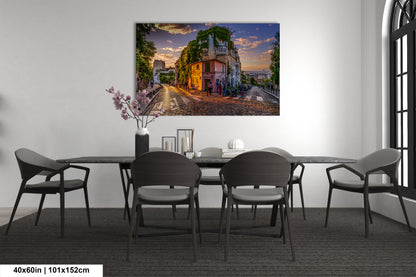 a room with a table and chairs and a painting on the wall