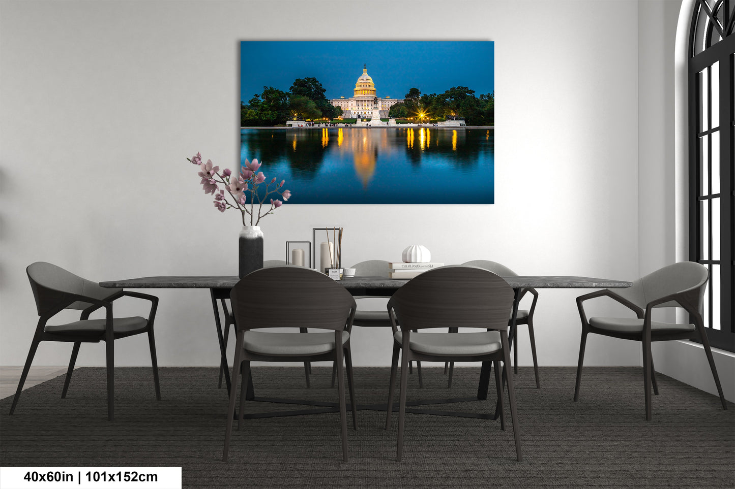 a dining room table with chairs and a picture of the capitol building