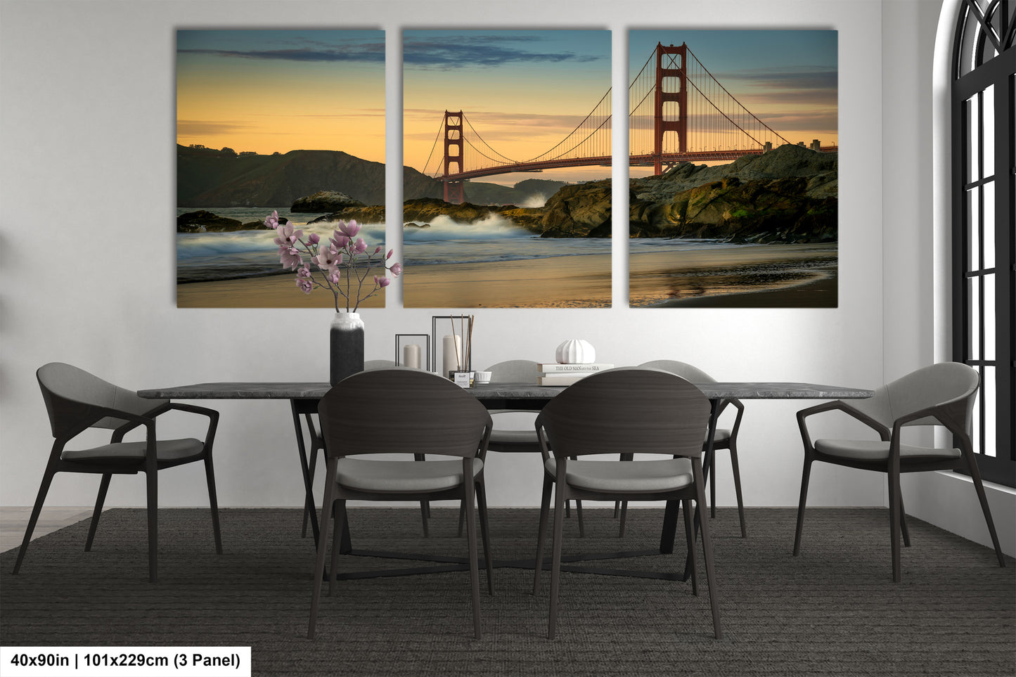 a dining room table with chairs and a painting of the golden gate bridge