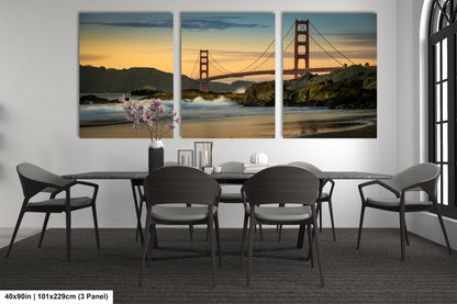 a dining room table with chairs and a painting of the golden gate bridge