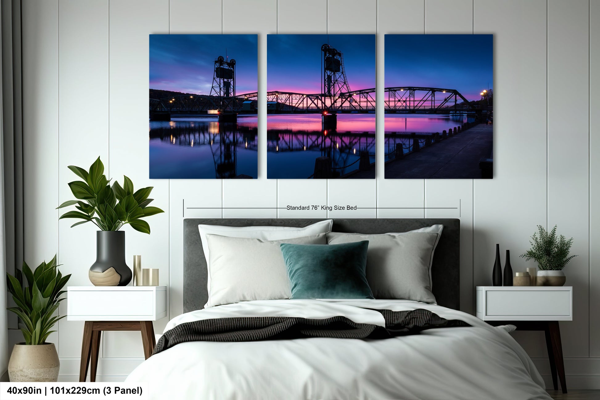 a bedroom with a bed and three paintings on the wall