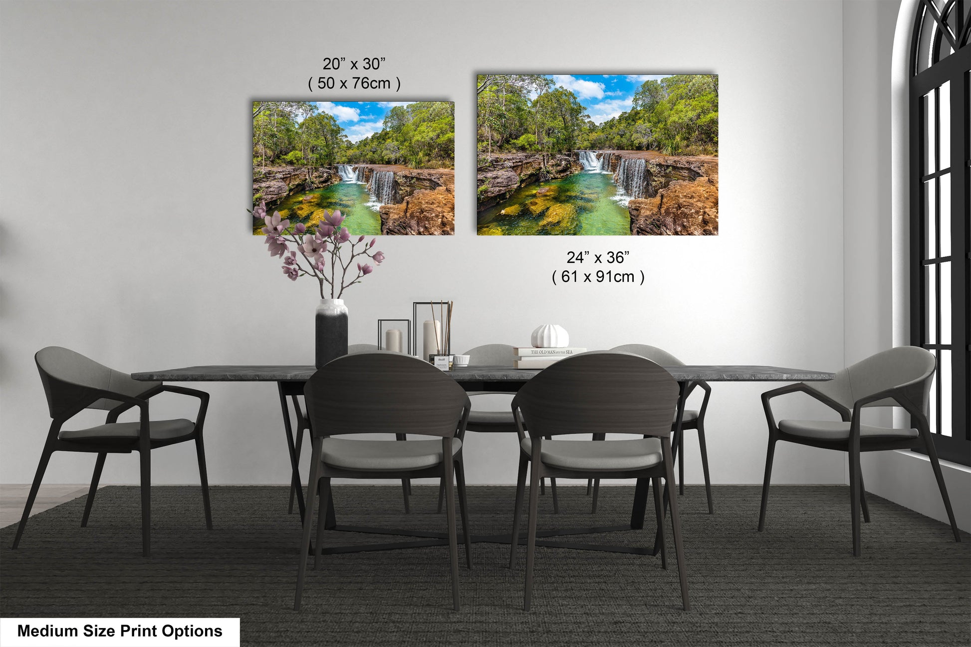 a dining room table with chairs and a vase with flowers