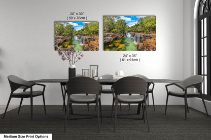 a dining room table with chairs and a vase with flowers
