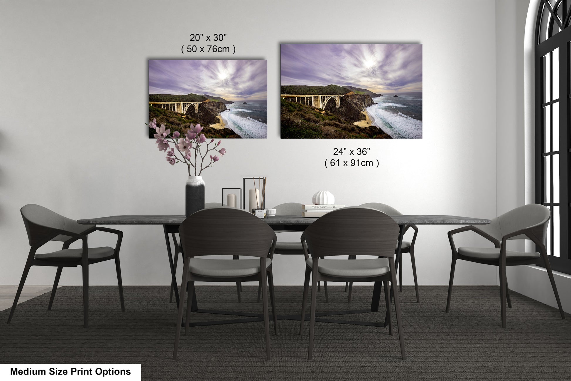 a dining table with four chairs and a vase of flowers