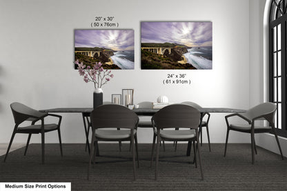 a dining table with four chairs and a vase of flowers