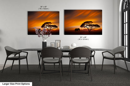 a dining room table with four chairs and a vase of flowers