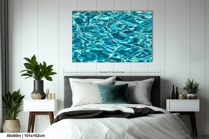 a bedroom with a large bed, nightstands, and a painting of water on the wall.