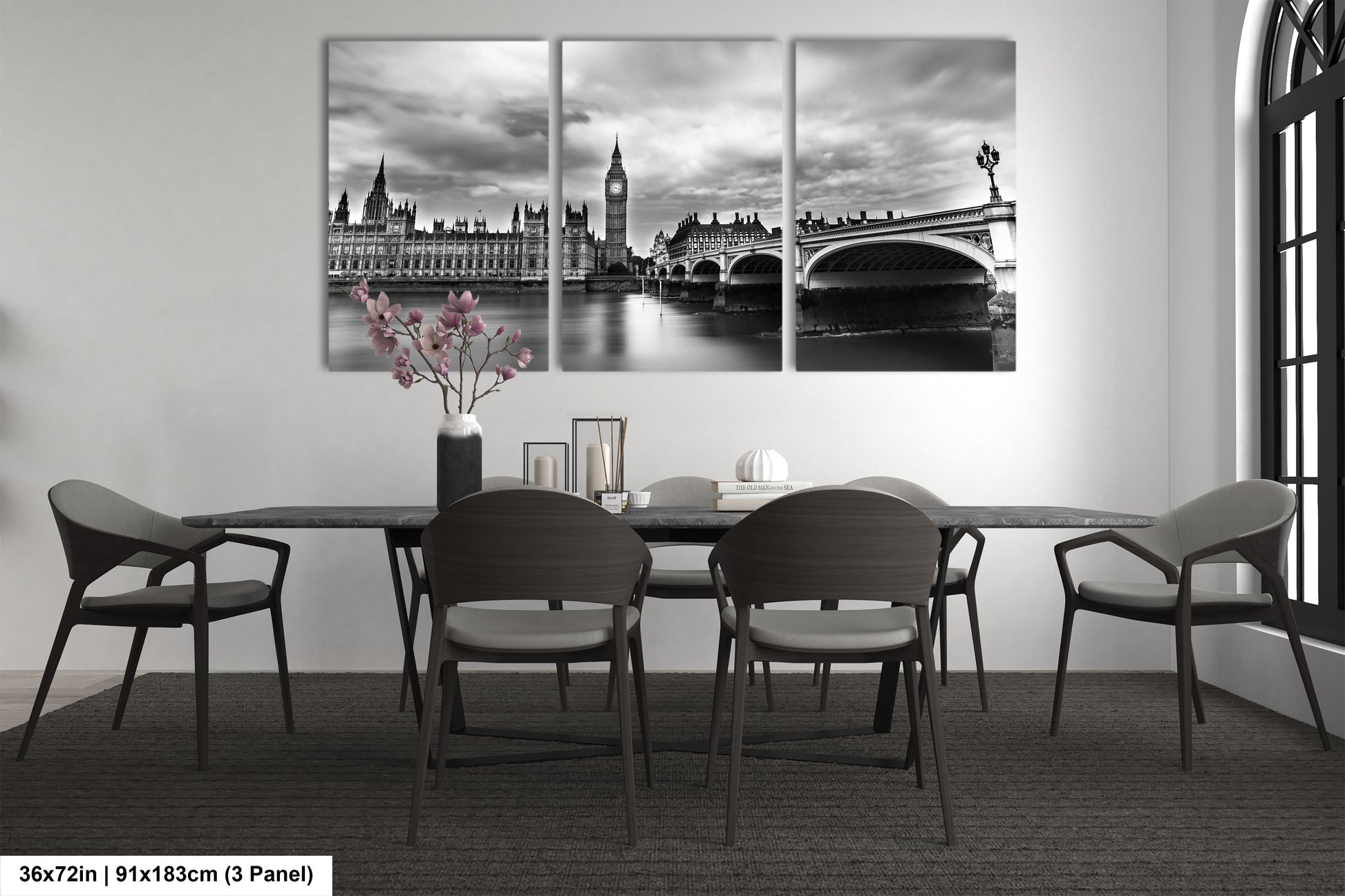a black and white photo of a dining room table