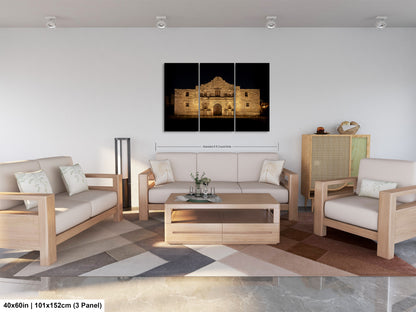 The image is a modern living room with a large, illuminated building in the background. The room is furnished with a sofa, two chairs, and a coffee table. The furniture appears to be made of wood and has a neutral color scheme. The room is well-lit, with natural light coming in from the windows. The overall design and layout of the room create a comfortable and inviting atmosphere.