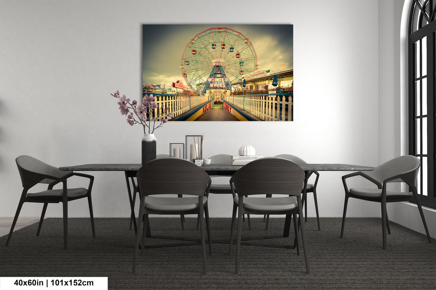 a dining room table with a ferris wheel in the background
