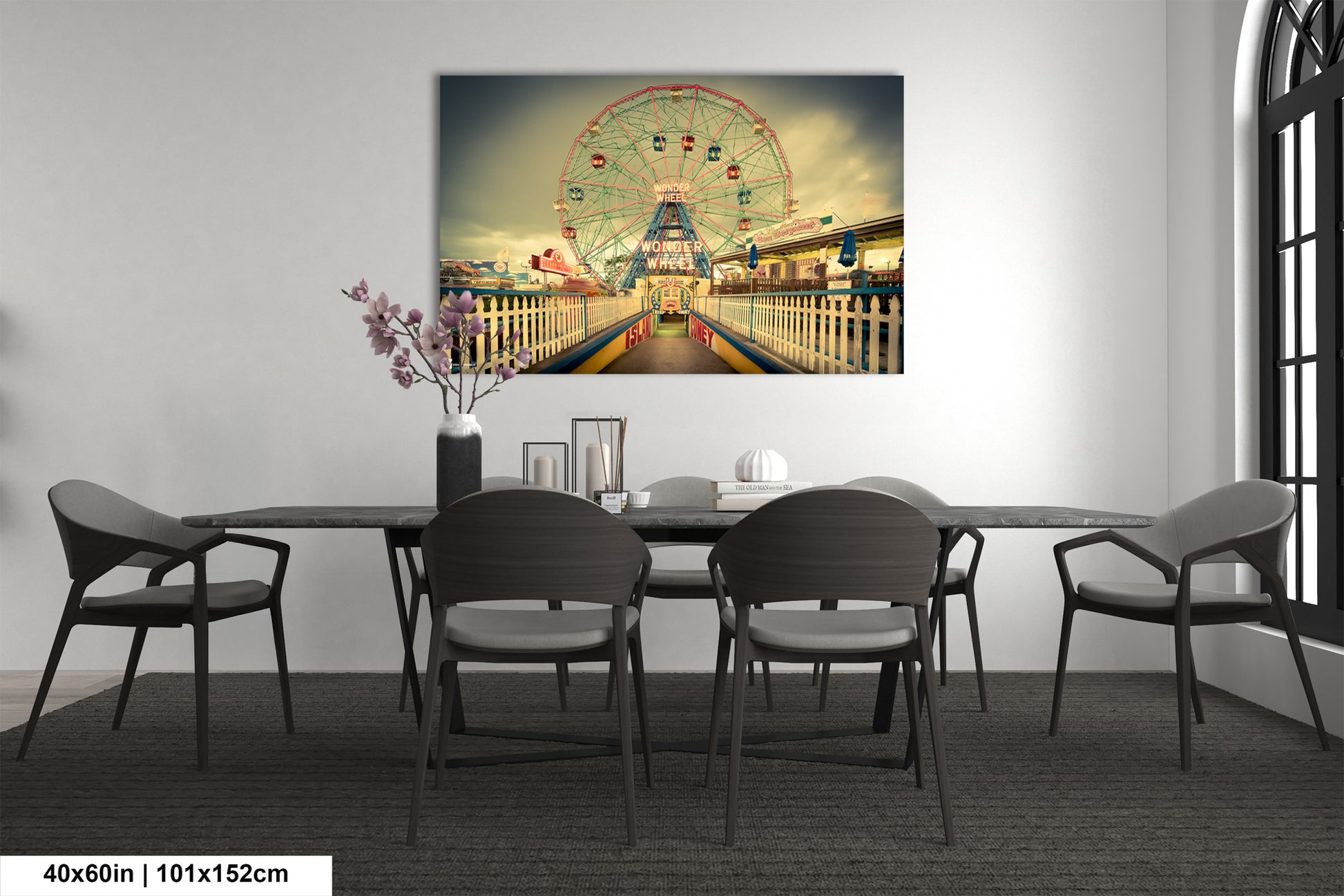 a dining room table with a ferris wheel in the background