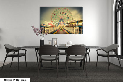 a dining room table with a ferris wheel in the background