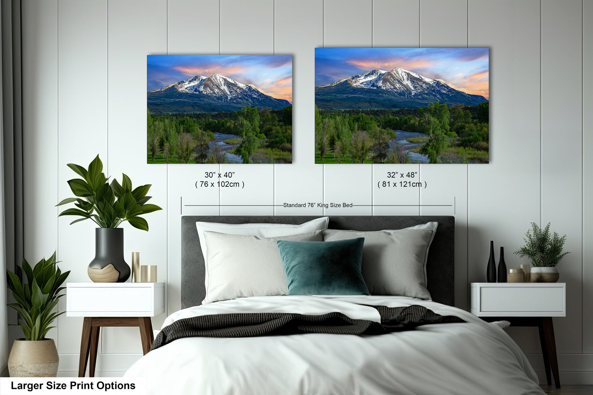 a bedroom with a bed and two pictures on the wall