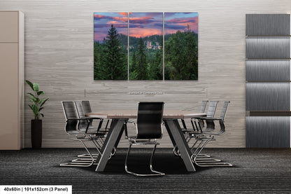 a dining room table with chairs and a painting on the wall